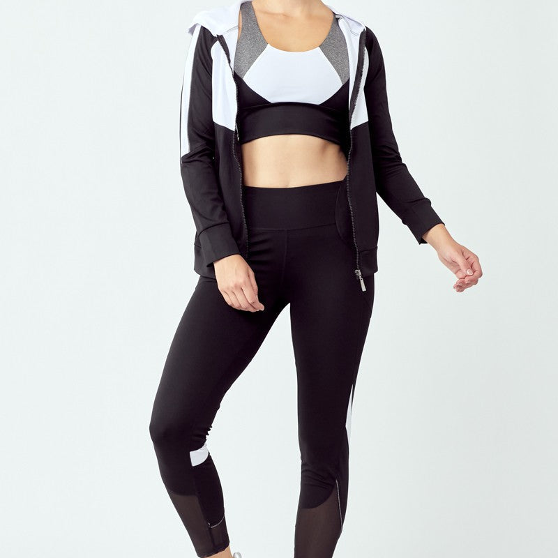 Women’s black and white 3-piece sportswear set with high-waisted leggings, stretch sports bra, and jacket, ideal for gym and yoga.