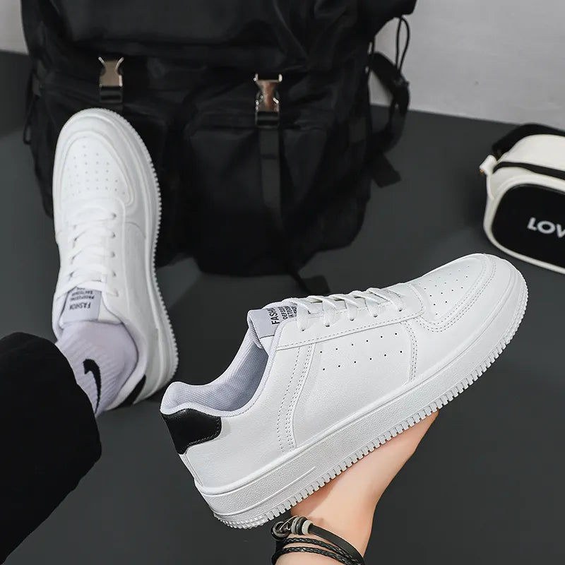 Unisex white platform sneakers with thick sole, suitable for casual wear, featuring a non-slip rubber outsole and lace-up closure.