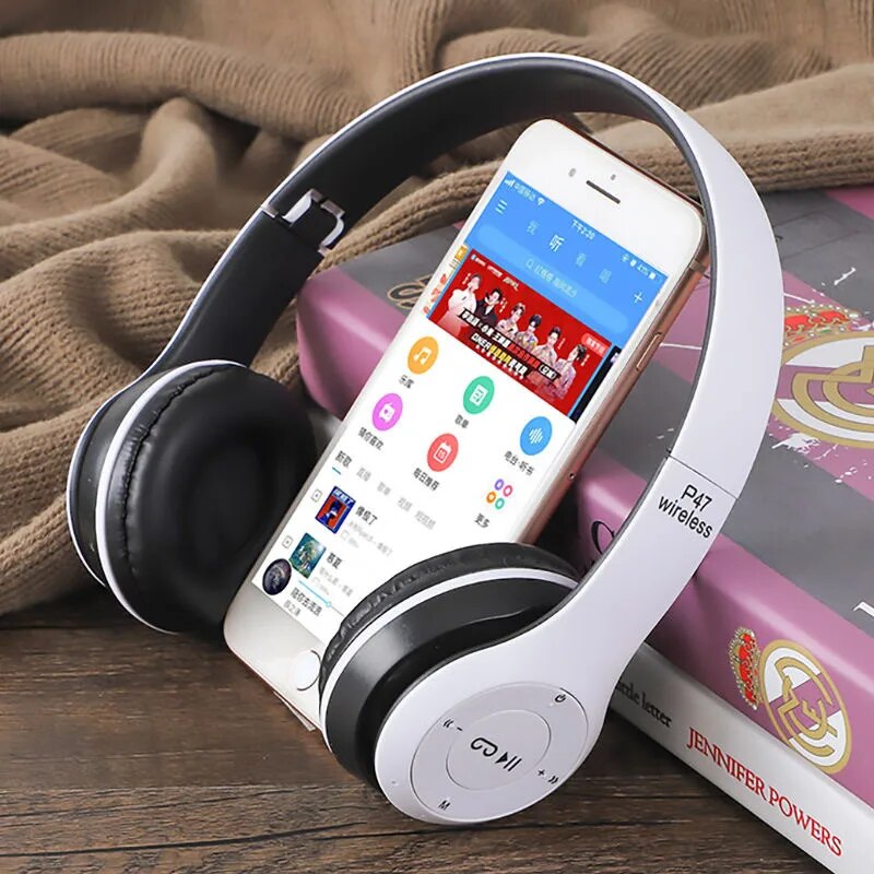 Stereo P47 Bluetooth headset with folding design, shown alongside a smartphone displaying a music app.