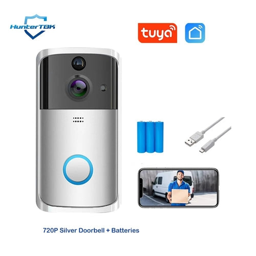 Smart home doorbell camera with batteries, USB cable, and mobile app connectivity.