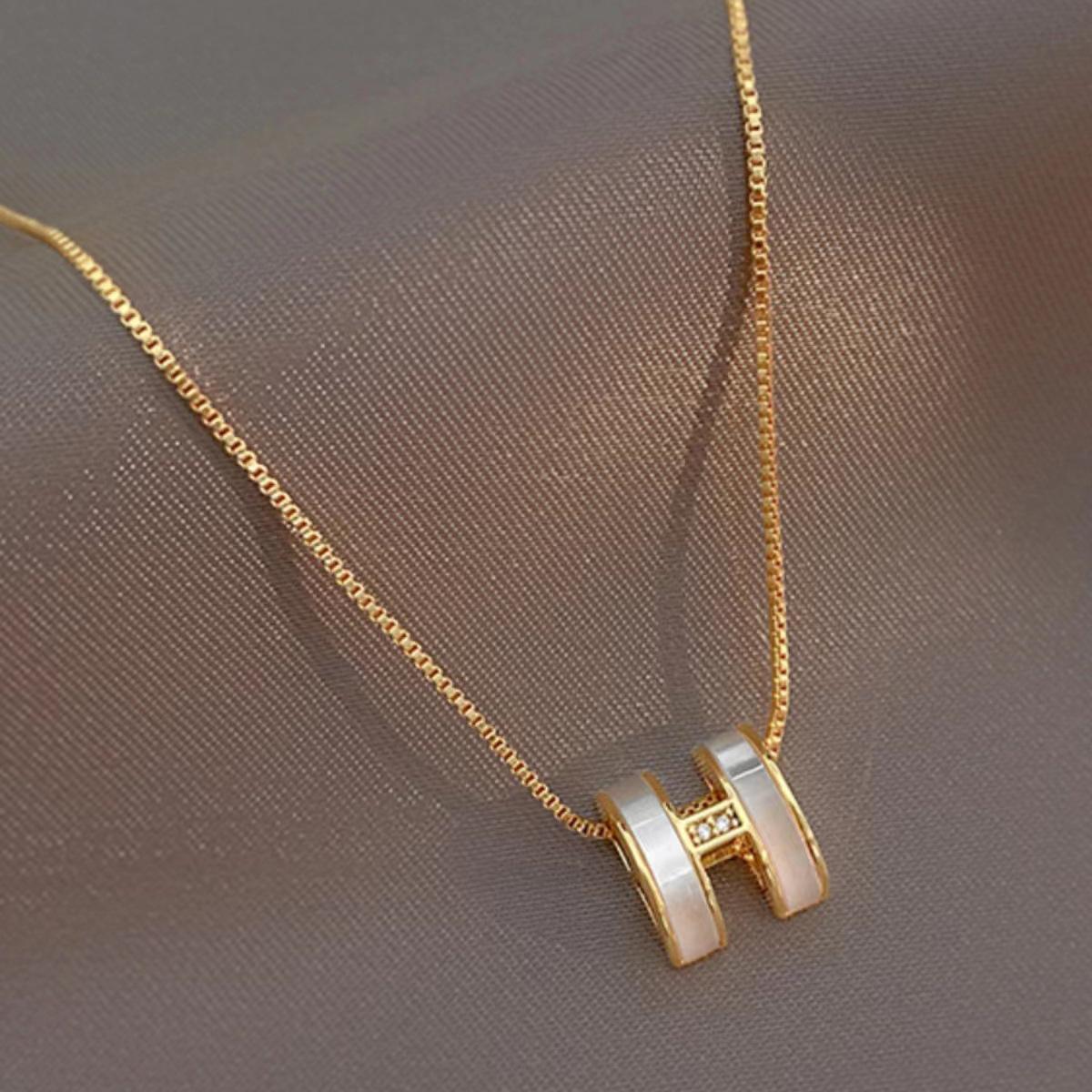 H letter rose gold necklace, simple and luxurious design.