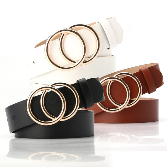 Women's leather belt with double O-ring buckle in black, brown, and white, suitable for jeans and waist cinching.