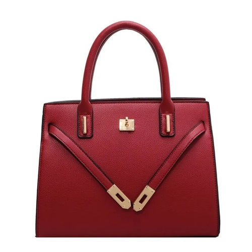 Handbag Women’s Luxury Leather Handbag in red with gold accents and dual handles.