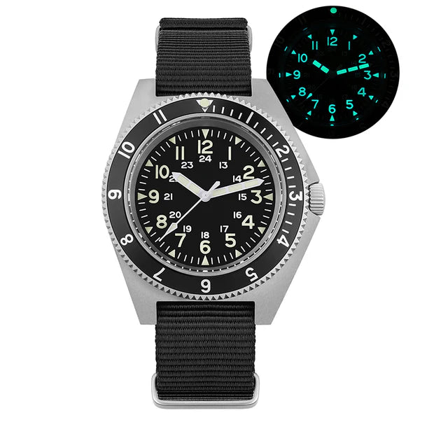 Wristwatch with black strap and glowing green face on a white background