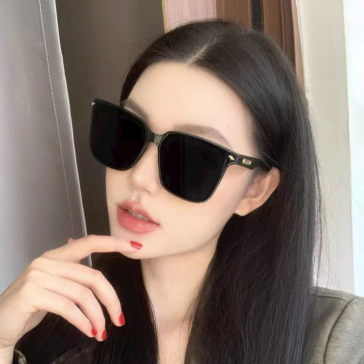 High-end black square sunglasses for women, anti-UV, fashion accessory for driving.